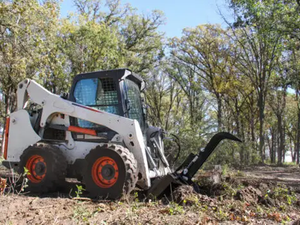 Erskine stump bucket grapple for skid steer loader