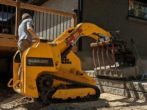 BaumaLight TRL620D stand on compact mini loader