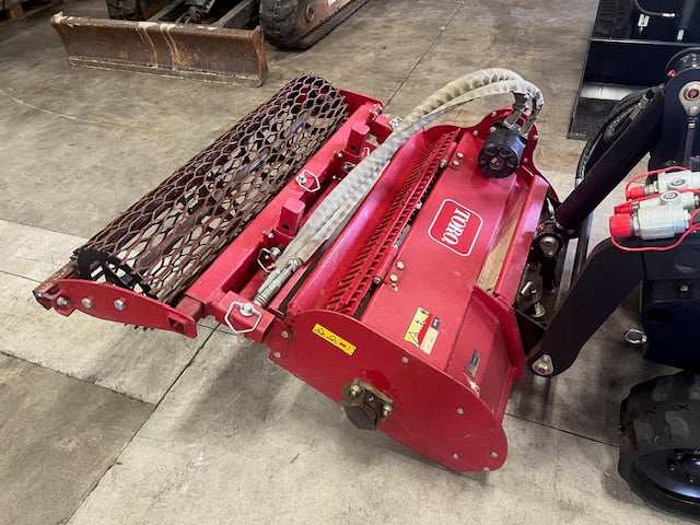 Used TORO soil cultivator for mini loader