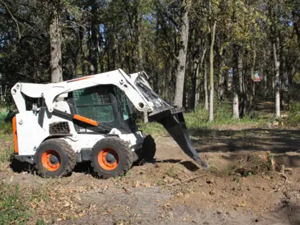 Erskine stump bucket for skid steer loaders