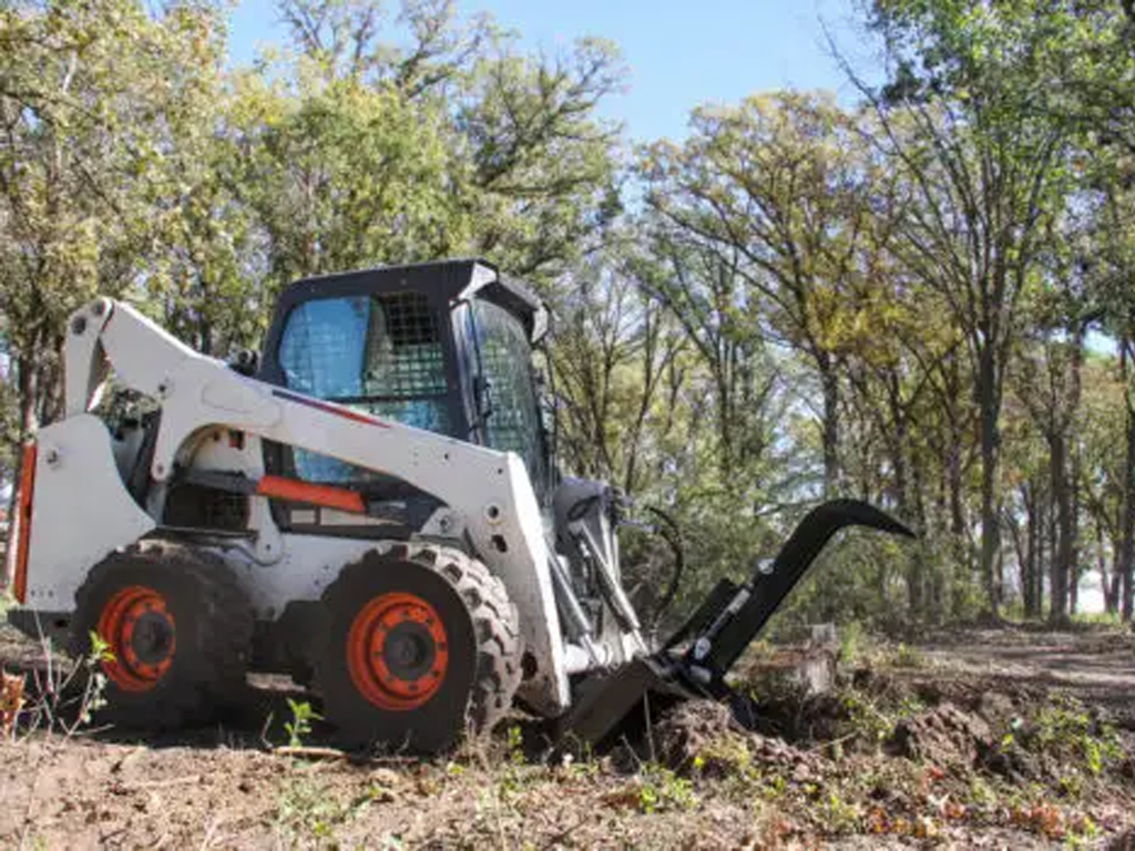 Erskine stump bucket grapple for skid steer loader