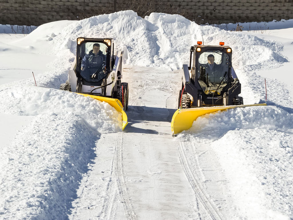 SnowWolf Ultra snow plows with trip edge for skid steer loaders